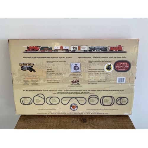 232 - A boxed Bachmann 'Jingle Bells Express' train set with four freight cars, HO scale