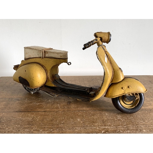 415 - A vintage 'Jayland' tin plate Vespa scooter, approx. 15