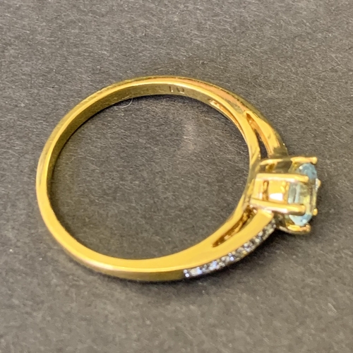 120 - A yellow metal ring marked '10' to shank, set with aquamarine and diamond chips, approx. size U, wei... 