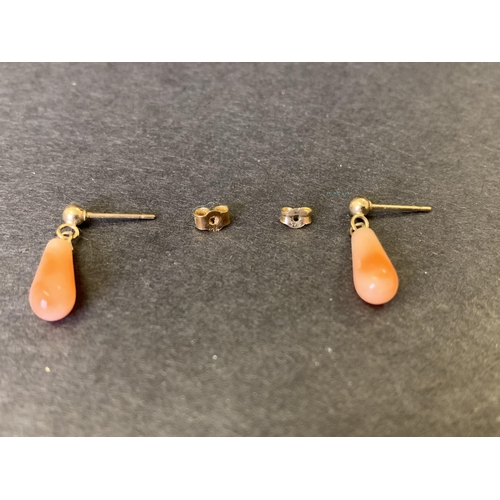 128 - Two pairs of 9ct gold coral earrings, marked on backs