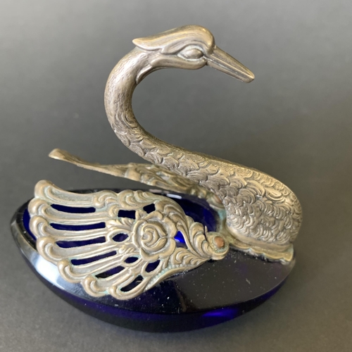 155 - A white metal and Bristol blue glass swan salt with moveable wings, approx. 3