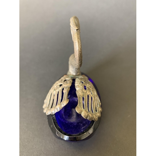 155 - A white metal and Bristol blue glass swan salt with moveable wings, approx. 3