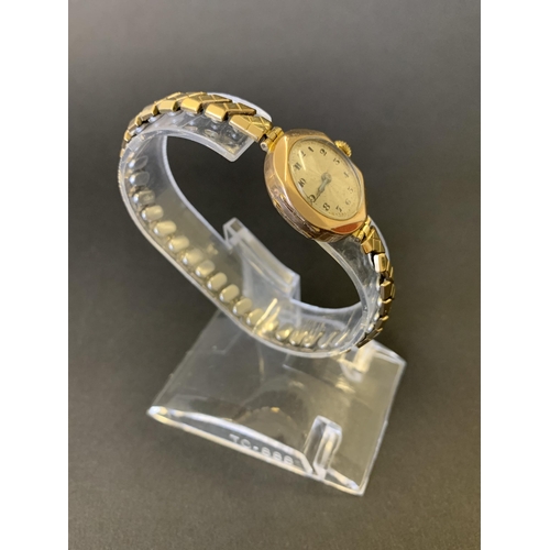 168 - A vintage 9ct gold cased ladies wristwatch with elasticated strap, 22mm dia (running at the time of ... 