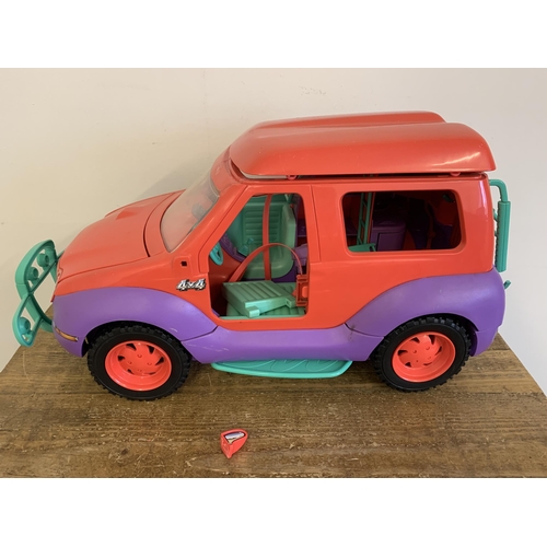 218 - A vintage Sindy jeep with accessories (damage to roof, as found), a Sindy wardrobe set plus an Aladd... 