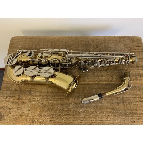 264 - A vintage Musica Steyr saxophone in its original case (looks to be complete, storage marks on metal ... 