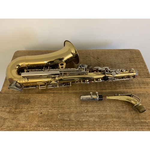 264 - A vintage Musica Steyr saxophone in its original case (looks to be complete, storage marks on metal ... 