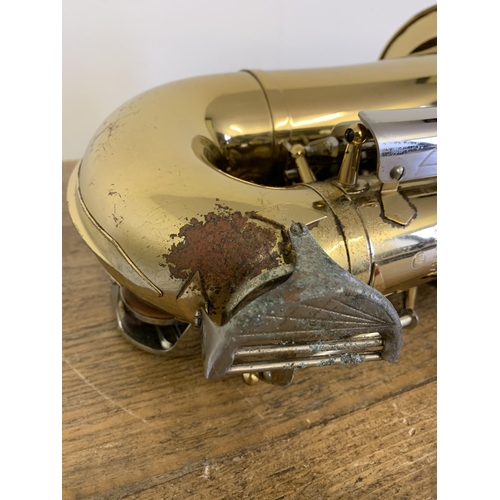 264 - A vintage Musica Steyr saxophone in its original case (looks to be complete, storage marks on metal ... 