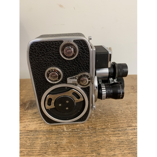 295 - Three vintage cameras to include a cased Kodak Duaflex, a cased Brownie and a Bolex Paillard D8L mov... 