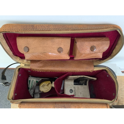 295 - Three vintage cameras to include a cased Kodak Duaflex, a cased Brownie and a Bolex Paillard D8L mov... 