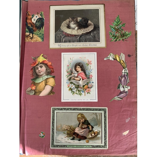 301 - A well filled Victorian/Edwardian scrap book with silk pages to include postcards, Christmas cards, ... 