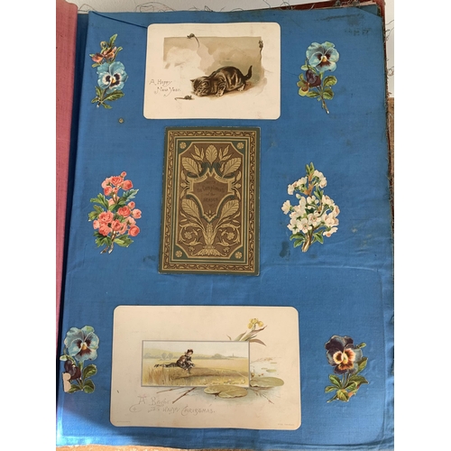 301 - A well filled Victorian/Edwardian scrap book with silk pages to include postcards, Christmas cards, ... 