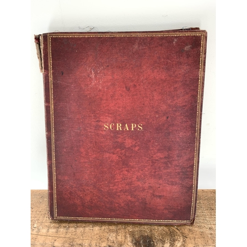 301 - A well filled Victorian/Edwardian scrap book with silk pages to include postcards, Christmas cards, ... 