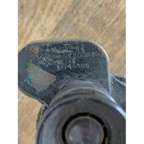 310 - A set of WW2 Taylor Hobson binoculars, dated 1941 (lots of wear with age)