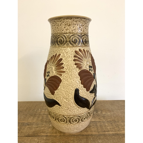 325 - A large ceramic West German vase decorated with flowers, marked '670 40 Bay' to base, 15 3/4