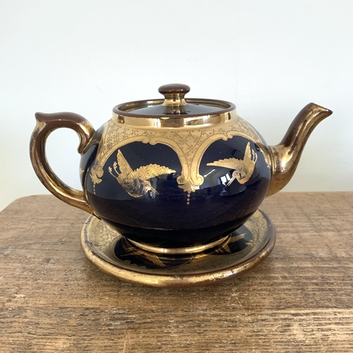 335 - A box of mixed ceramics including a vintage Gibsons cobalt blue and over gilt teapot and stand, Coro... 