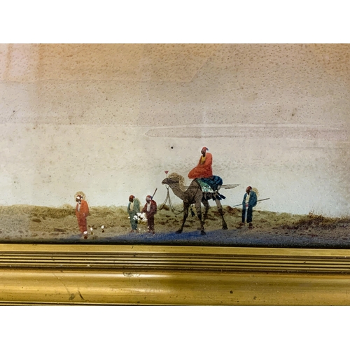 349 - An antique framed watercolour on paper/card of a camel and figures in the desert, marked 'Bramids fr... 