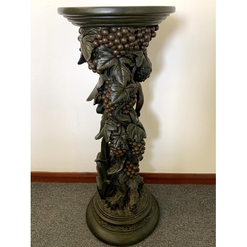 385 - A faux bronze resin cherub jardiniere stand, approx. 33