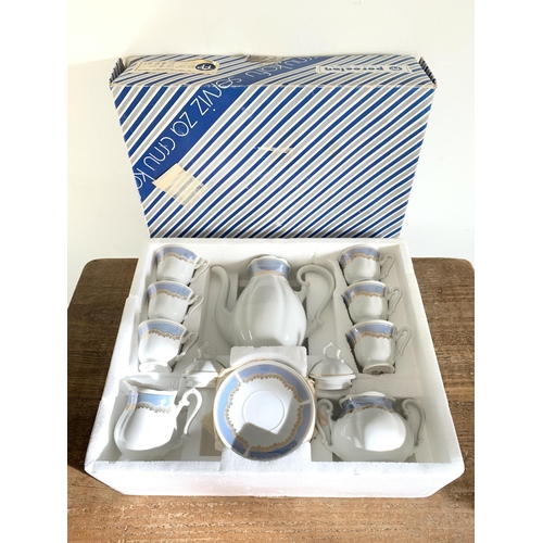 398 - A boxed Yugoslavian porcelain six setting coffee set