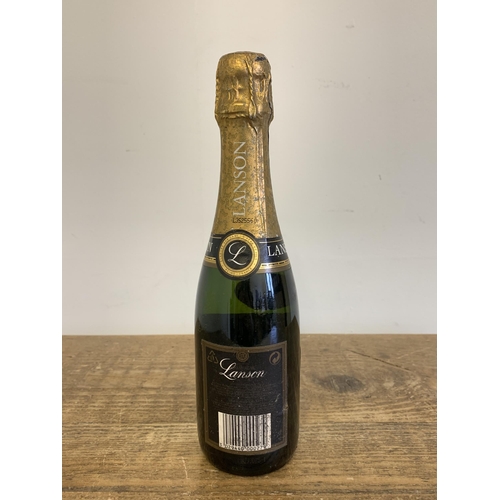 46 - A small bottle of 2002 Queen's Golden Jubilee Lanson Champagne, 37.5cl