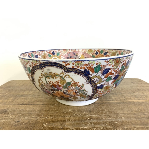 70 - A very large vintage Oriental ceramic hand painted bowl decorated with birds and flowers, Oriental c... 