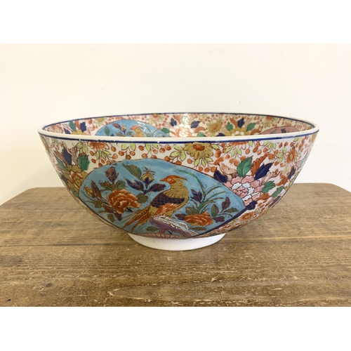 70 - A very large vintage Oriental ceramic hand painted bowl decorated with birds and flowers, Oriental c... 