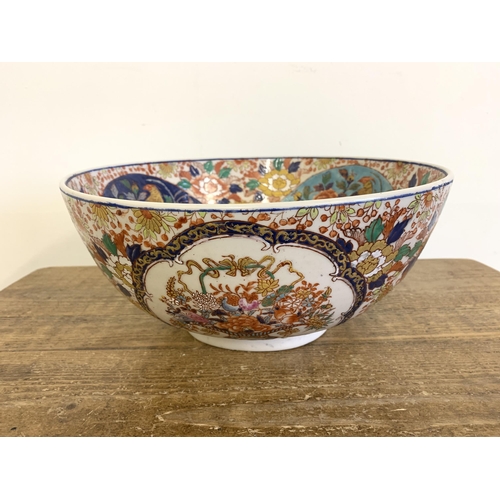 70 - A very large vintage Oriental ceramic hand painted bowl decorated with birds and flowers, Oriental c... 