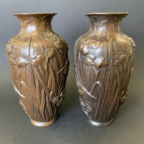 72 - A pair of vintage bronzed metal vases decorated with storks in reeds, approx. 7 3/4