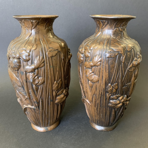 72 - A pair of vintage bronzed metal vases decorated with storks in reeds, approx. 7 3/4