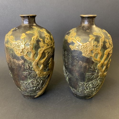 73 - A pair of antique Chinese bronze vases with gold painted decoration highlighting birds in branches, ... 