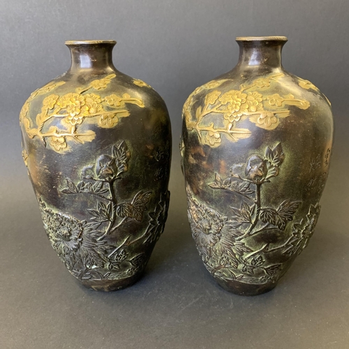 73 - A pair of antique Chinese bronze vases with gold painted decoration highlighting birds in branches, ... 