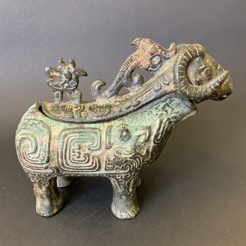 74 - An unusual antique Chinese metal goat, possibly pouring jug, top section lifts off, approx. 7