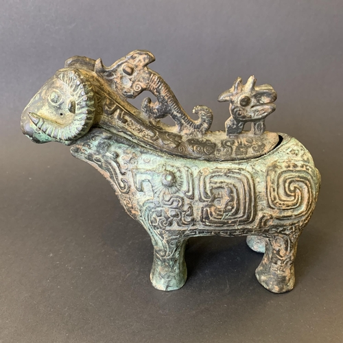 74 - An unusual antique Chinese metal goat, possibly pouring jug, top section lifts off, approx. 7