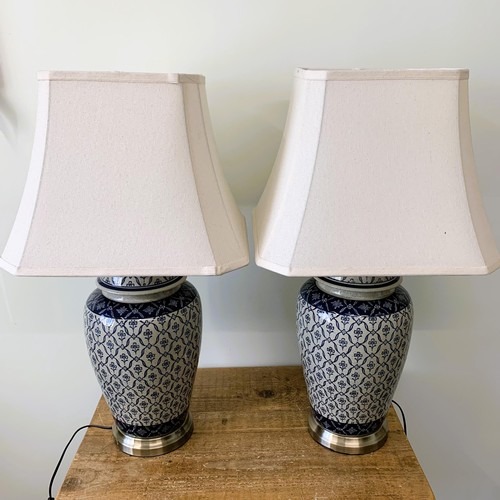 428 - A pair of Oriental style ceramic base table lamps with shades, approx. 29