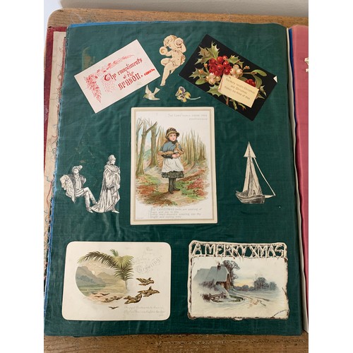 301 - A well filled Victorian/Edwardian scrap book with silk pages to include postcards, Christmas cards, ... 