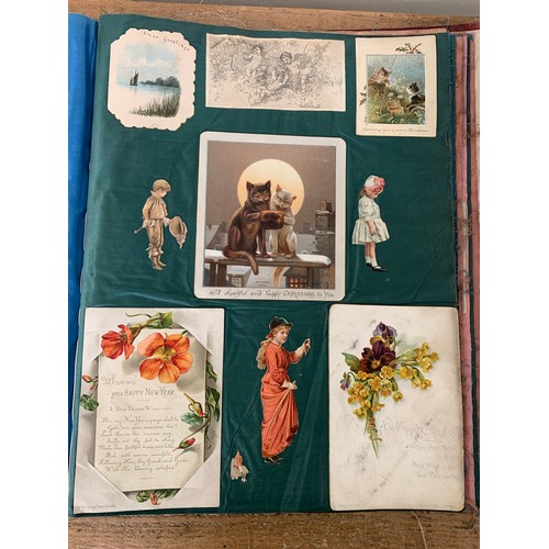 301 - A well filled Victorian/Edwardian scrap book with silk pages to include postcards, Christmas cards, ... 