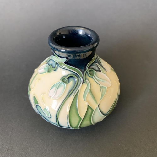 1 - A Moorcroft vase in the 'Snowdrop' pattern by Rachel Bishop, dated 2002, just over 2