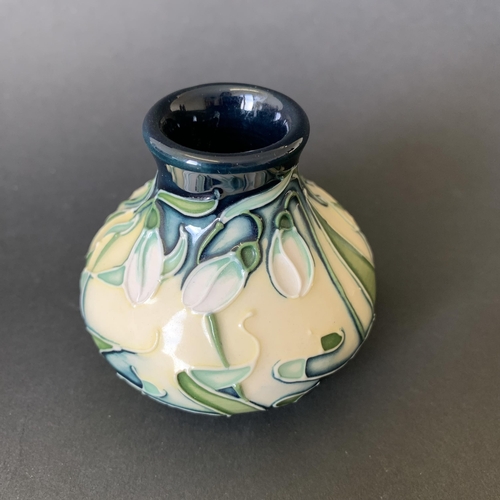 1 - A Moorcroft vase in the 'Snowdrop' pattern by Rachel Bishop, dated 2002, just over 2