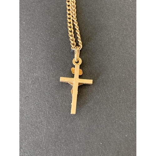 117 - A yellow metal cross on chain, various parts are indistinctly marked, the jump ring is 14ct, weight ... 