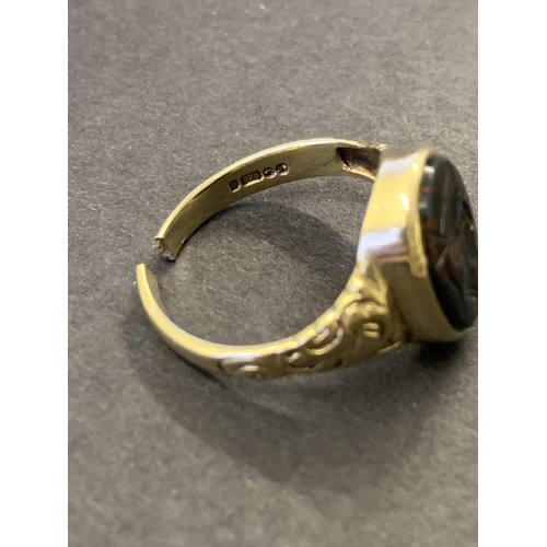 127 - A 9ct gold and carved seal top ring, the shank has been cut so approx. size T, weight approx. 4.7g