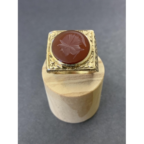 129 - A chunky 9ct gold and carved carnelian seal stone set ring, approx. size U, weight approx. 10.5g