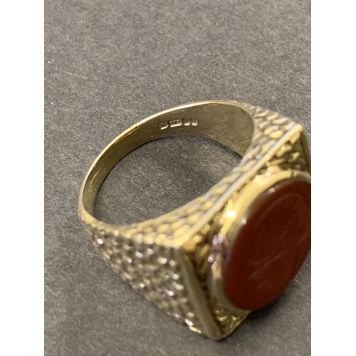 129 - A chunky 9ct gold and carved carnelian seal stone set ring, approx. size U, weight approx. 10.5g