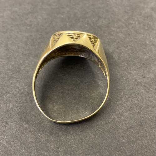 130 - A 9ct gold ring with bird emblem to top, possibly a seal, approx. size T, weight approx. 7g (the sha... 