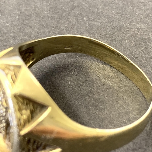 130 - A 9ct gold ring with bird emblem to top, possibly a seal, approx. size T, weight approx. 7g (the sha... 