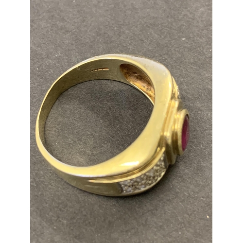 131 - A 9ct gold ring with large red stone and diamond chip shoulders, approx. size V, weight approx. 8.2g