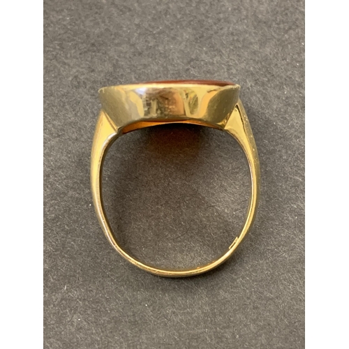 133 - A gold ring set with carved carnelian seal, possibly of Shakespeare, marks rubbed but '18' is visibl... 