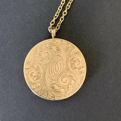 143 - A 9ct gold locket on yellow metal chain, locket weight approx. 11.2g, total weight approx. 17g