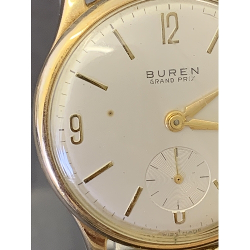 151 - A 9ct gold Buren Grand Prix wristwatch on elasticated yellow metal strap and with engraving on the b... 