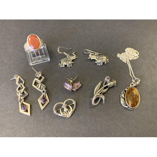 172 - A selection of mixed sterling silver jewellery including an amber pendant, three pairs of earrings, ... 