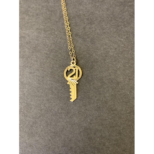 178 - A 9ct gold 21st key on yellow metal chain, total weight approx. 0.9g