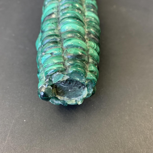 187 - A polished malachite in the form of a corn cob, 8 1/2